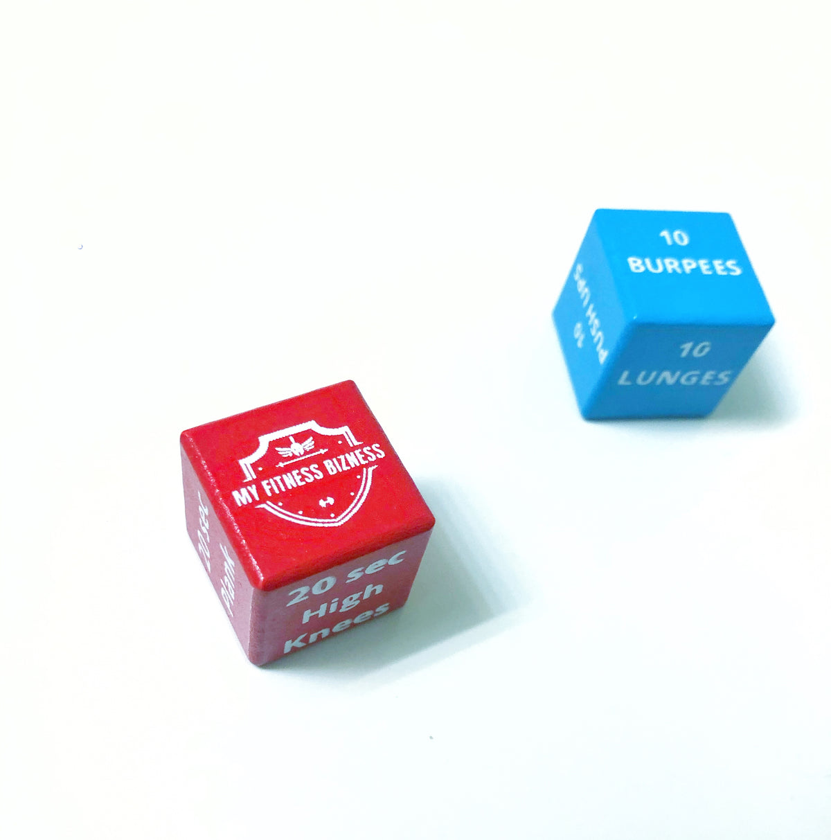 Red Cardio Fitness Die and blue Body Weight Fitness Die for the ROLKAH exercise dice game